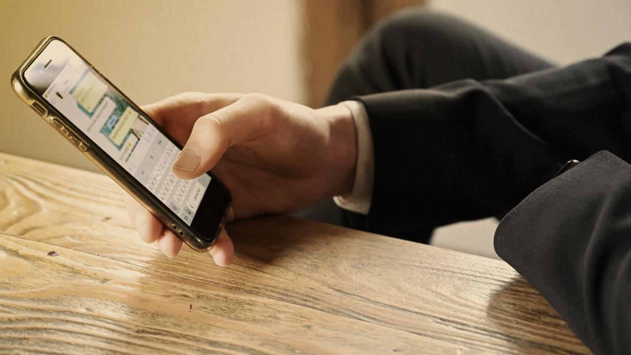An operator checking a work message on their phone