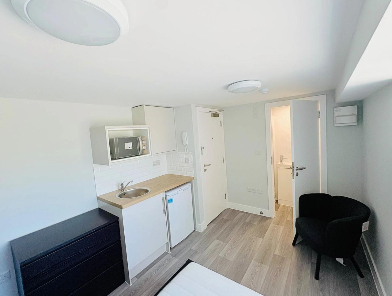 A unit's private kitchenette and door
