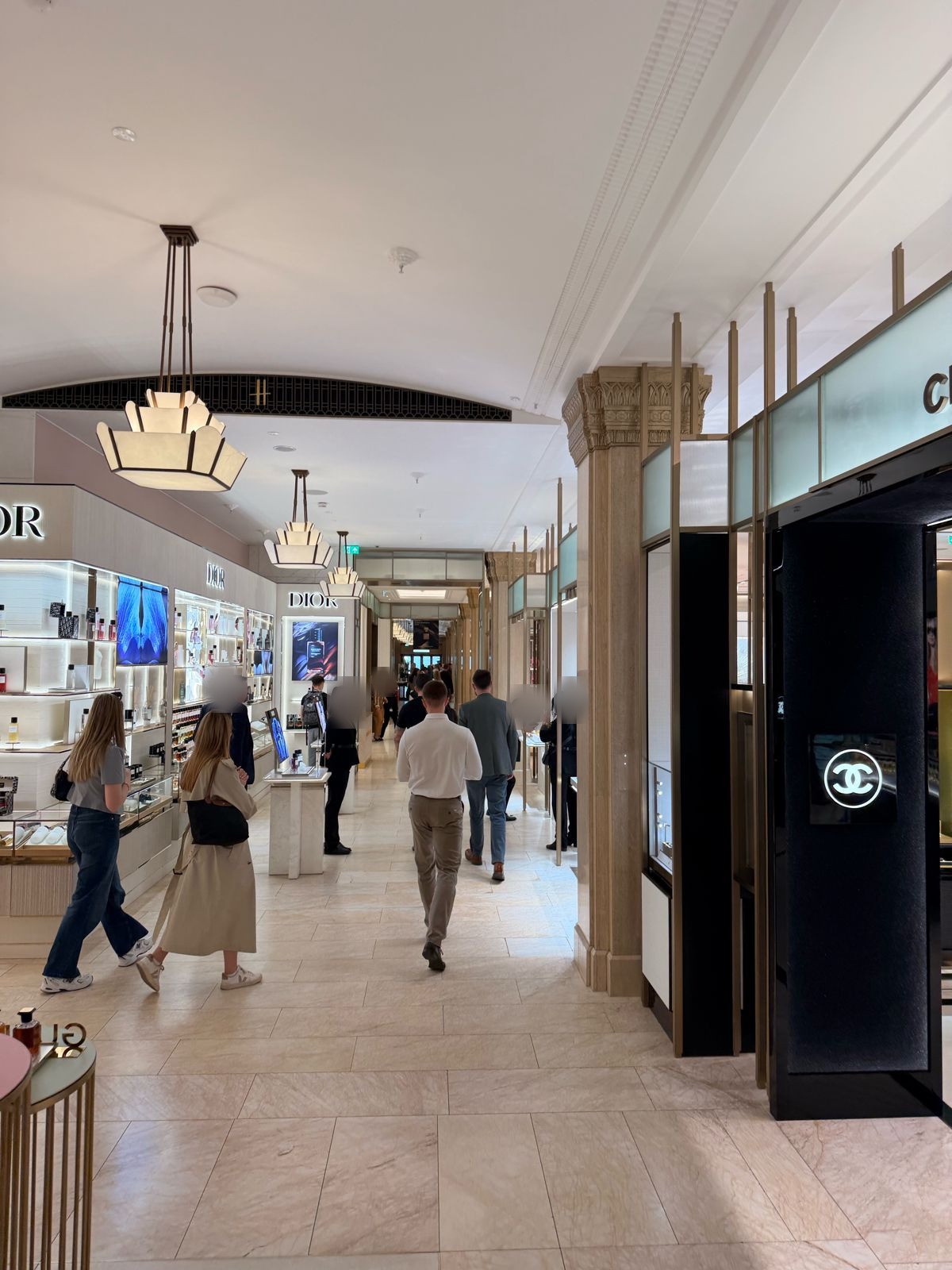 Close protection trainees on a course exercise in the beauty hall at Harrods